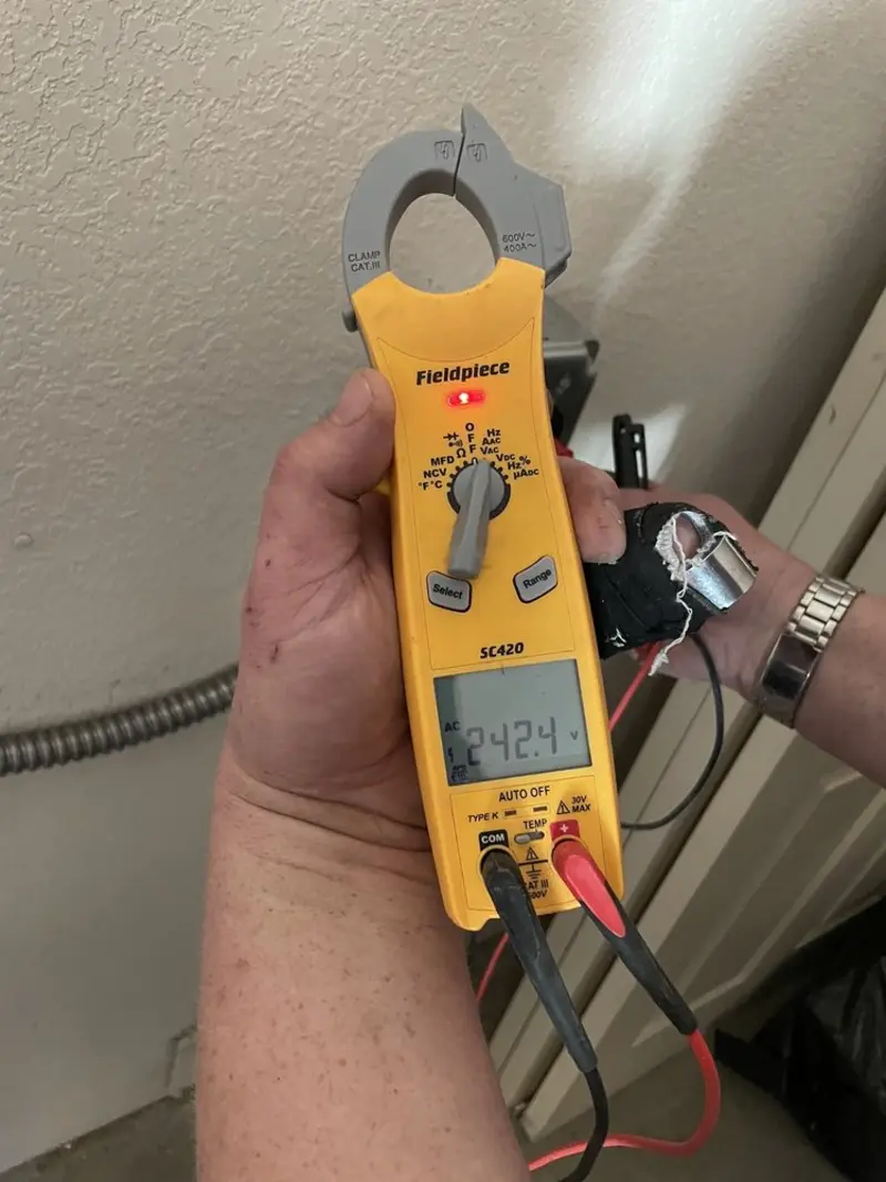 Voltage testing with clamp meter during Electrical Installation Services in Birmingham